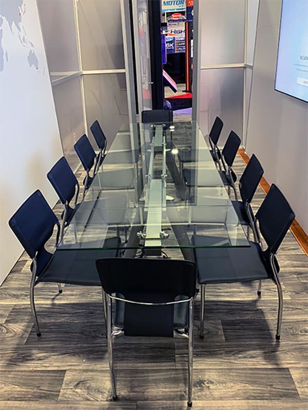 Delano Conference Table with Black Terry Chairs - LV Exhibit Rentals in Las Vegas