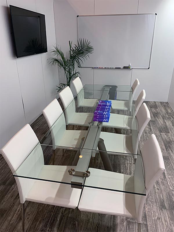 Delano Conference Table with White Diana Chairs - LV Exhibit Rentals in Las Vegas