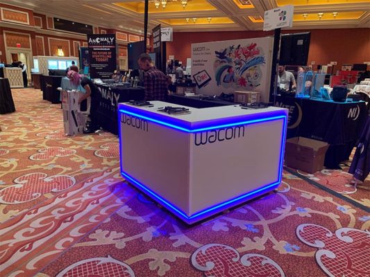 Trade Show Counter Rental Package C2 - LED L-Shaped Reception Counter - Wacom CES 2020 - LV Exhibit Rentals in Las Vegas