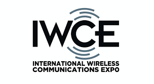 IWCE logo for the International Wireless Communications Expo, featuring bold black letters with blue wireless signal design elements.