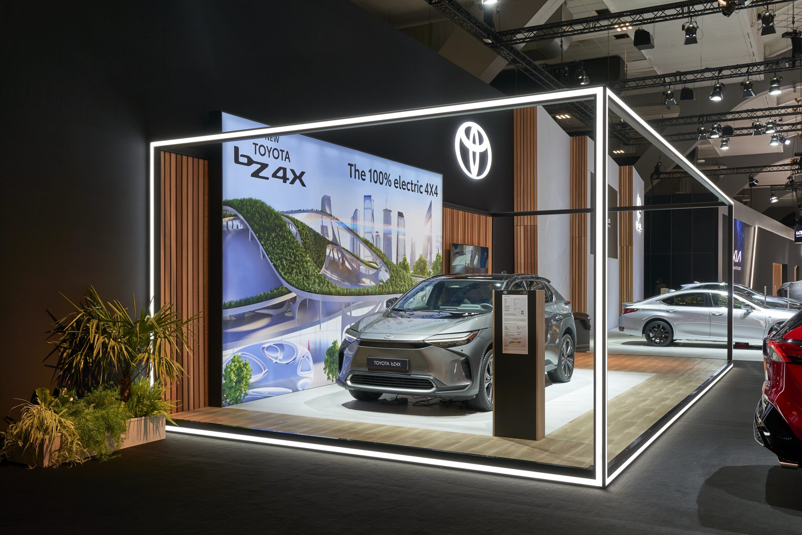 Toyota exhibit outlined by white edge lighting around a vehicle graphic and display area.