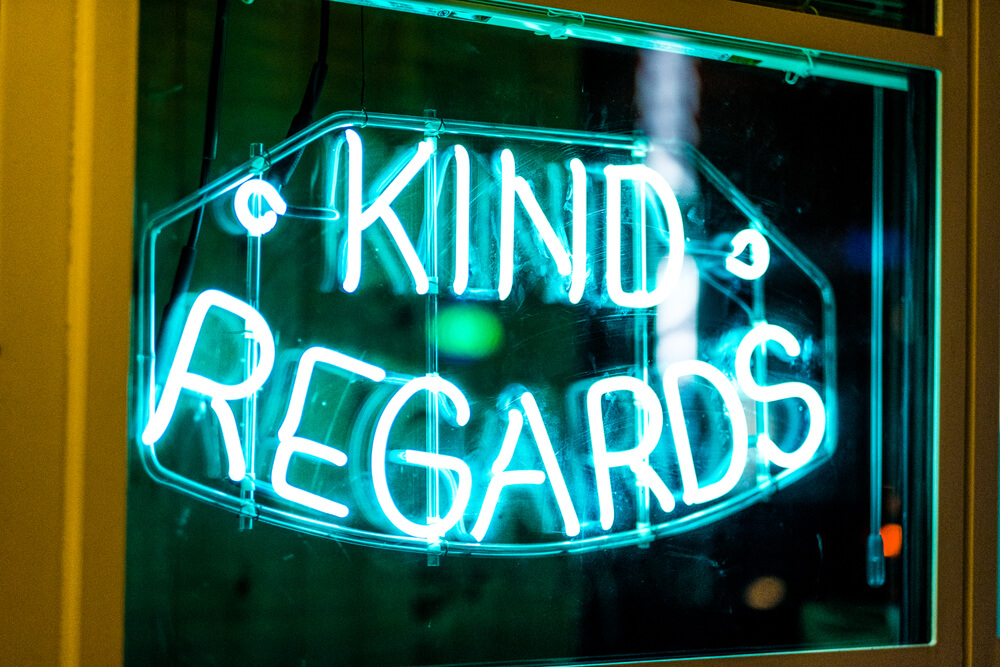 Adding a neon sign is among the most eye-catching 30x30 trade show booth ideas.